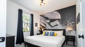 A modern bedroom with a large bed, black nightstands, a wall mural, and a window with curtains. - Luxury 3 Bed Home up to 8 guests- The Hub - 3236 TT (Kissimmee)