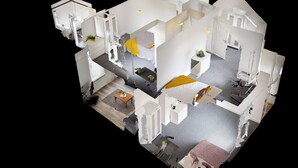 A 3D model of a hotel room with a bed, bedside table, and a small seating area. - City Centre-University Home from Home (Sunderland)