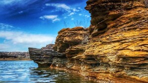 A natural rock formation by a body of water with clear skies. - Freshly Updated house near Wilson Lake, Kansas’s nicest lake!!! (Lucas)