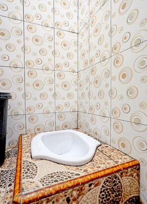 Habitación doble | Baño | Regadera y toallas 
