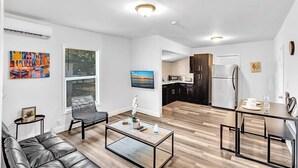 A modern apartment with a living room, dining area, and kitchen. - Hallandale Mins From Beach & Aventura Mall HN01 (Hallandale Beach)