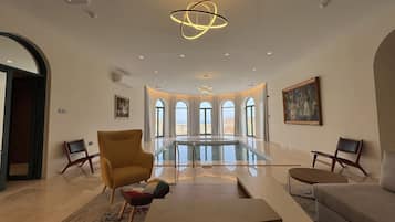 Three Bedroom Chalet | Living area | 43-inch Smart TV with satellite channels, table tennis