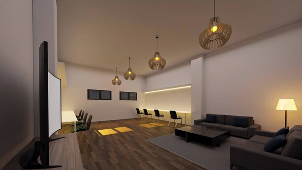 A modern living room with a flat-screen TV, wooden flooring, a sofa, a coffee table, and a seating area with chairs. - Girona Centre 7pax Aparcamiento Coche,moto,bicicleta (Girona)