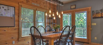 Amber Sunsets dazzles with panoramic views, hot tub luxury, a custom firepit, screened porch, pool table, and pet-friendly hospitality!