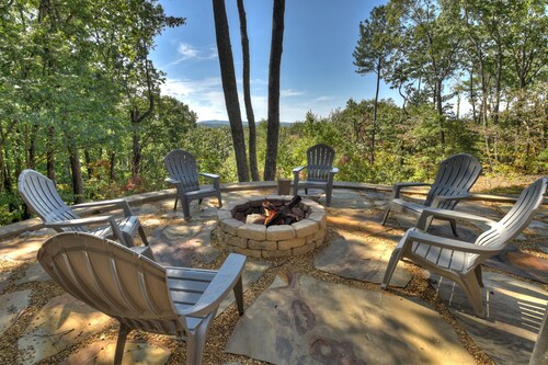 Amber Sunsets dazzles with panoramic views, hot tub luxury, a custom firepit, screened porch, pool table, and pet-friendly hospitality!