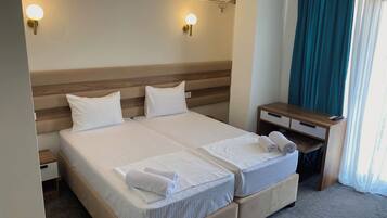 Pillowtop beds, desk, laptop workspace, free WiFi