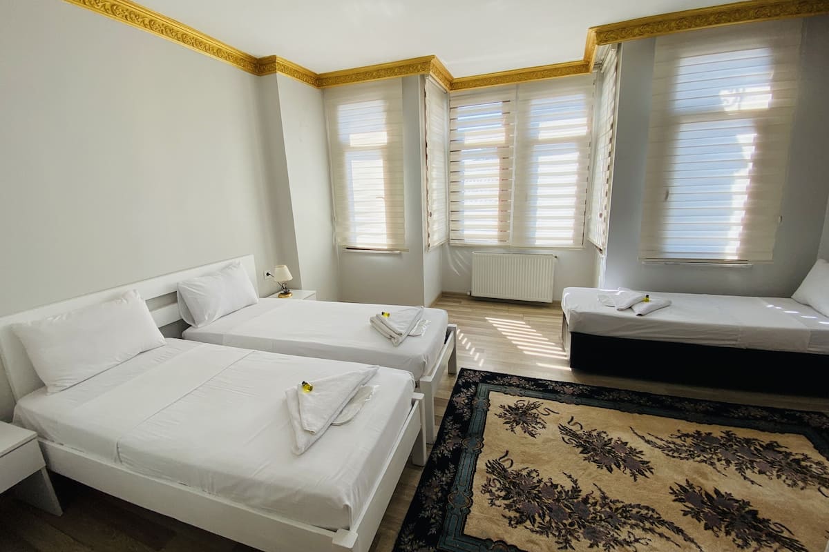 Deluxe Triple Room | Premium bedding, in-room safe, soundproofing, iron/ironing board