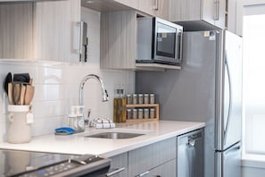 Condo | Private kitchen | Full-size fridge, microwave, oven, stovetop