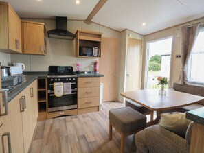 Fridge, electric kettle, toaster, cookware/dishes/utensils