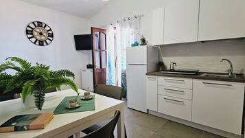 Panoramic Apartment, 1 Bedroom, Kitchenette, Sea View | Private kitchen | Full-size fridge, stovetop, cookware/dishes/utensils, dining tables