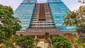 The exterior of the Vincom Center building with a modern glass facade and a central entrance. - The Rixx Vincom Center (Ho Chi Minh City)