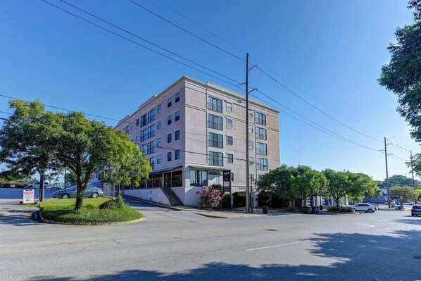 A multi-story building with a flat facade, large windows, and a visible entrance.