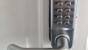 A door with a numeric keypad lock and a lever handle. - Ravenhill Town house  Belfast (Belfast)