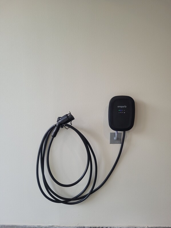 A black wall-mounted device with a cable connected to it. - Bulson Creek 1 Bedroom Guest House Suite
(Mount Vernon)