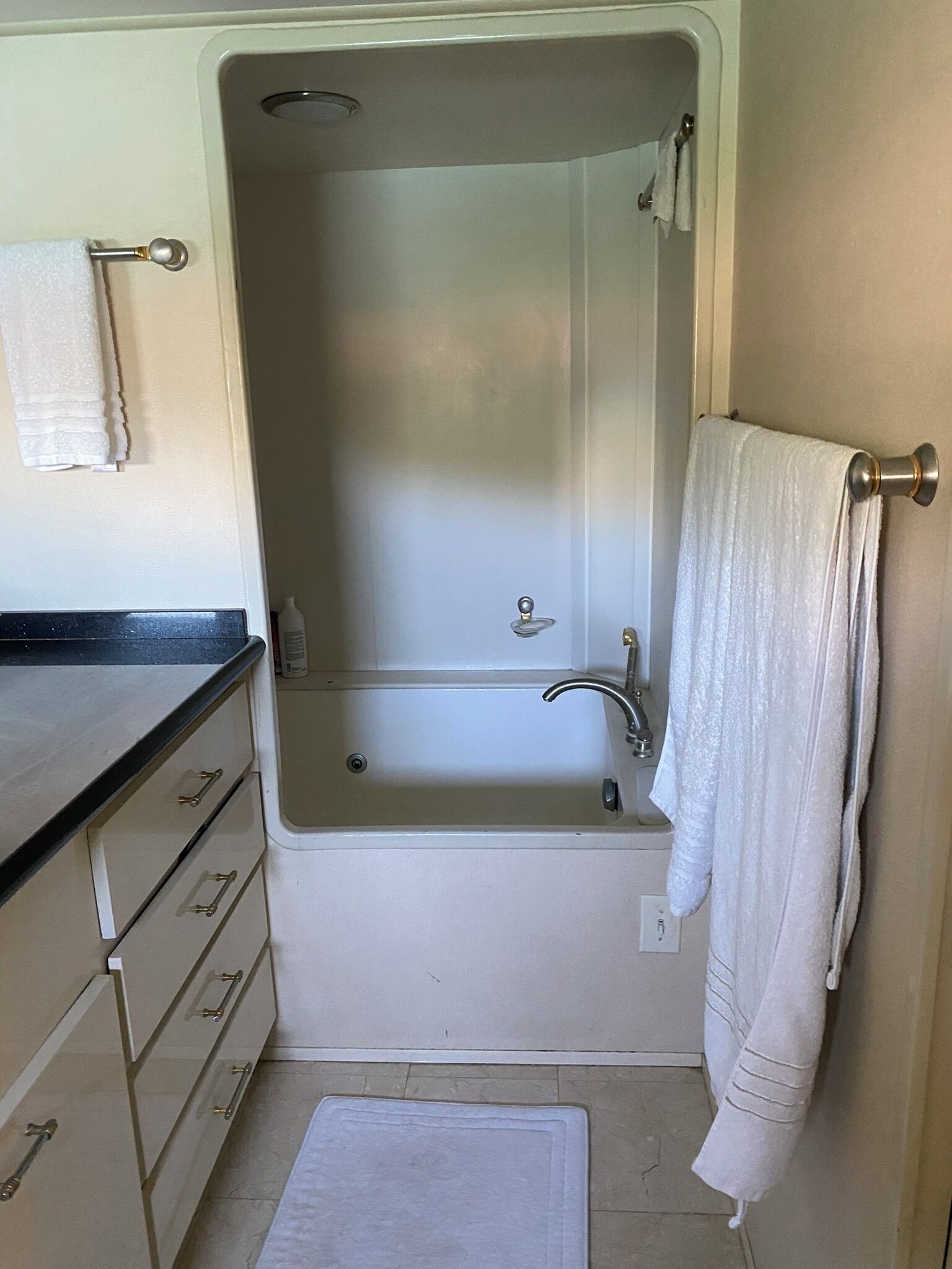A bathroom with a bathtub, a shower, and a toilet.