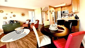 A dining area with a round table, chairs, and a coffee station. - Iconic Dahlonega View! In Town! WINE GOLD HIKING (Dahlonega)