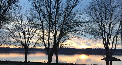 Sunset Waters: Serene Retreat on the Mississippi River Shoreline Fisher Friendly