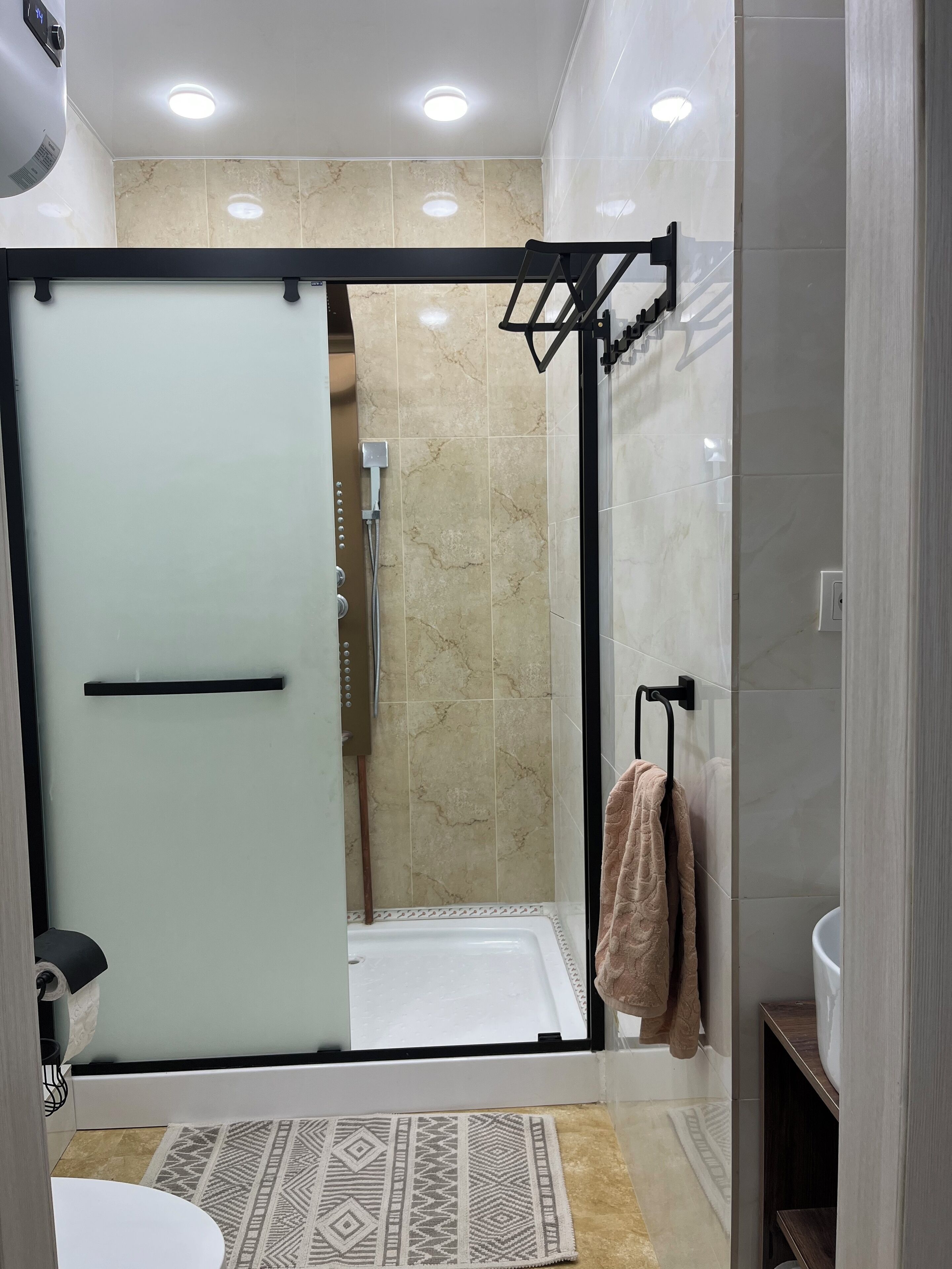 Shower, hair dryer, towels, soap
