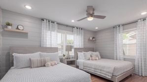 A bedroom with two beds, a ceiling fan, and a window with blinds. - Charming Bungalow in the heart of Phoenix/Biltmore area.  (Phoenix)