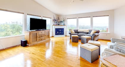 Peek-a-boo ocean view home with in-law suite, fireplace, & outdoor space