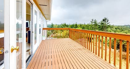 Peek-a-boo ocean view home with in-law suite, fireplace, & outdoor space