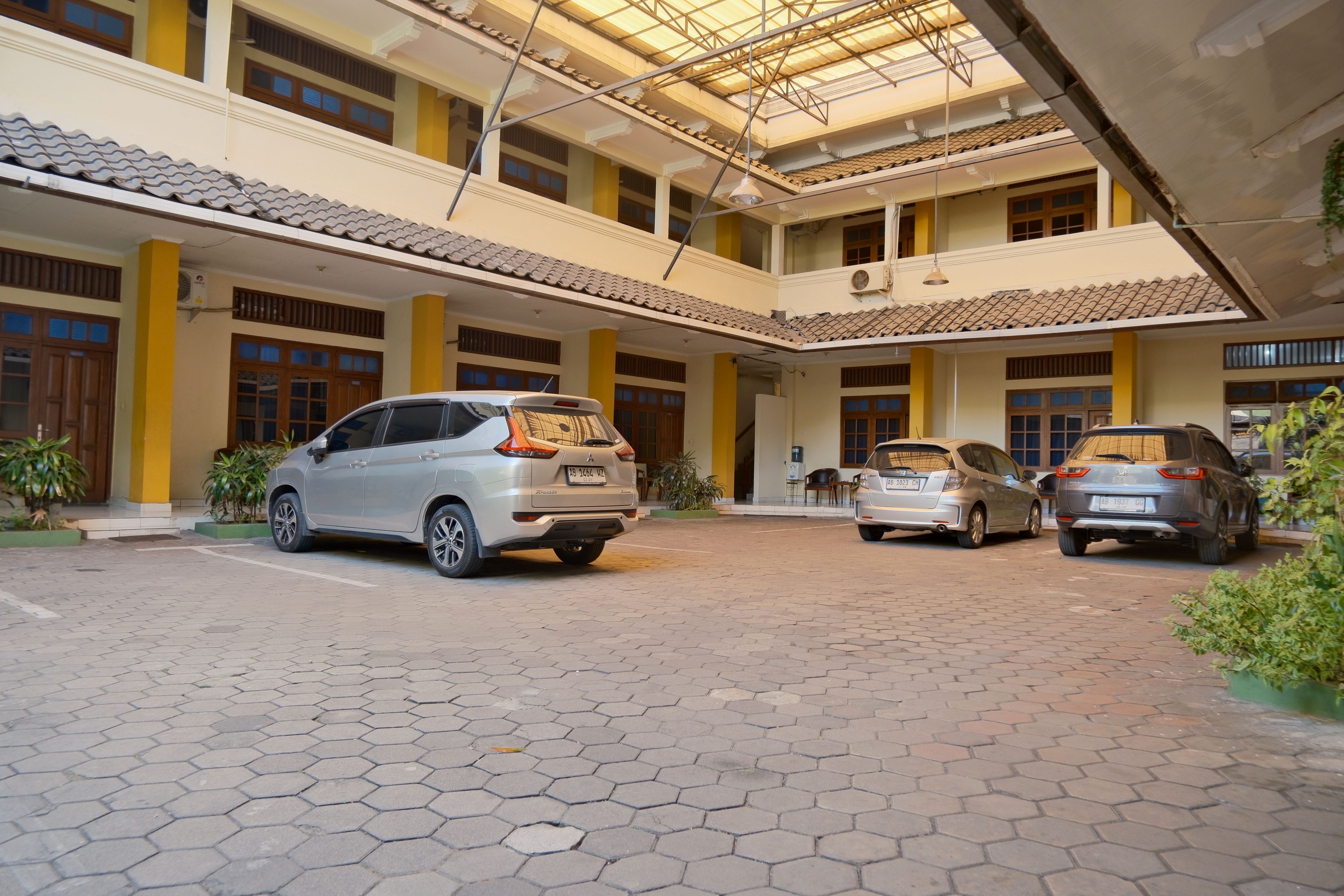 A multi-level building with a covered parking area.