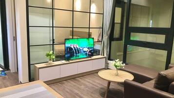 Apartment, 1 Bedroom | Living area | Flat-screen TV