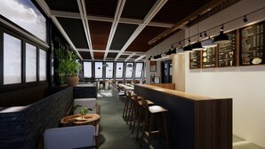 A modern interior with a long counter, seating area, and large windows. - Funhome Bo Song Set Apartment Ha Noi (Hanoi)