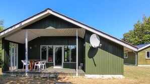 A single-story house with a covered porch, a satellite dish, and a small deck area. - "Jaane" - 650m to the fjord by Interhome (Hemmet)