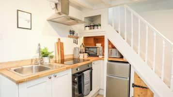 Fridge, electric kettle, toaster, cookware/dishes/utensils