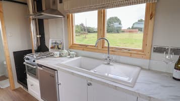 Fridge, electric kettle, cookware/dishes/utensils