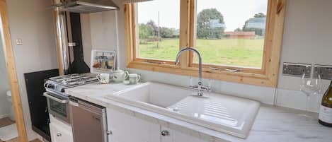Fridge, electric kettle, cookware/dishes/utensils
