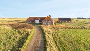 A rural house with a gravel path leading to it, surrounded by open fields. - "Answald" - 250m from the sea by Interhome (Harboøre)