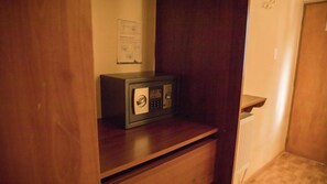 A secure safe on a wooden shelf in a hallway. - HOSTAL SOLOR (San Pedro de Atacama)