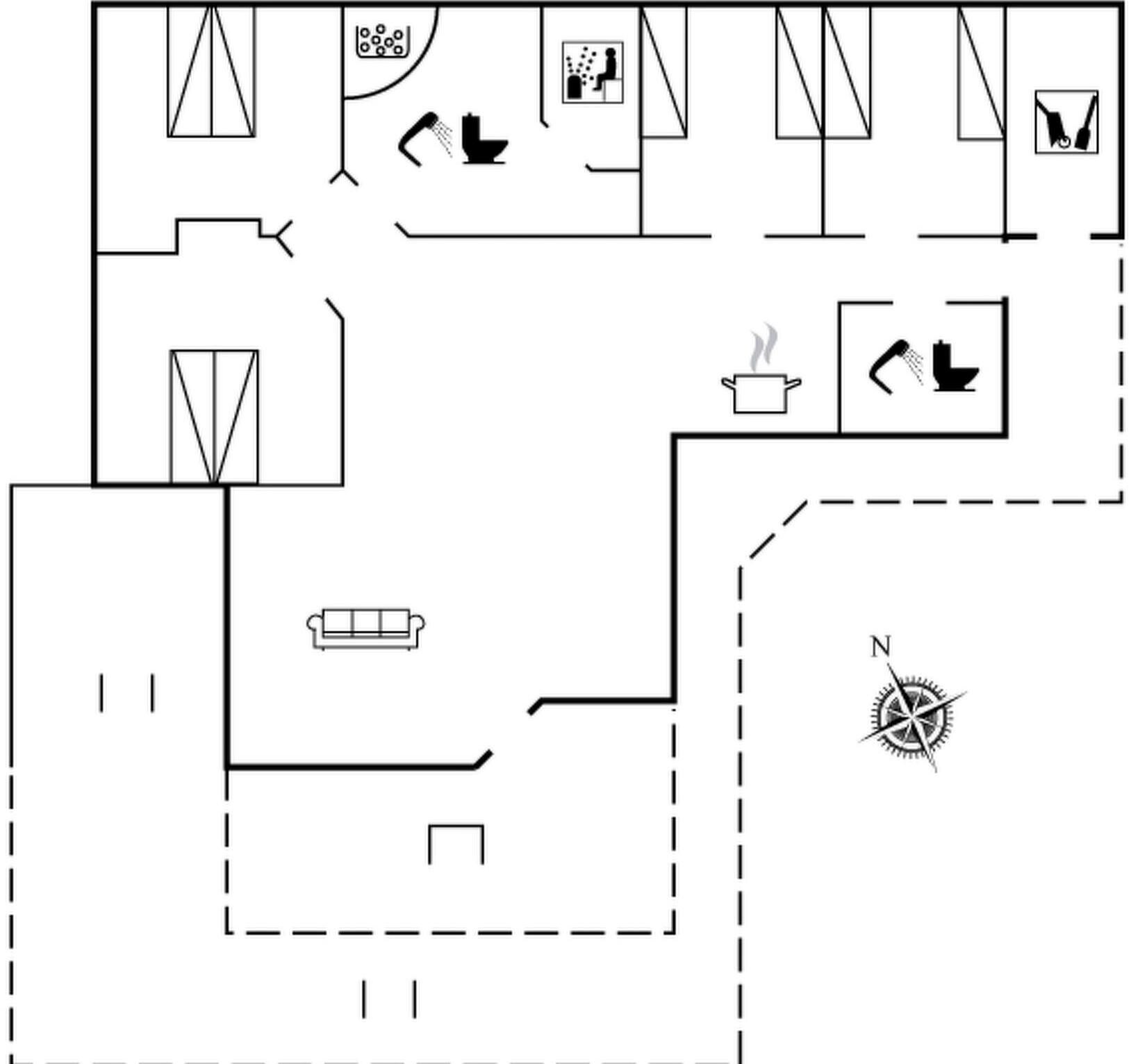 A floor plan with a kitchen, dining area, and a living room with a sofa.