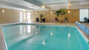 An indoor swimming pool with clear water, surrounded by brick walls and a high ceiling. - "Stilla" - 35km from the sea by Interhome (Højer)