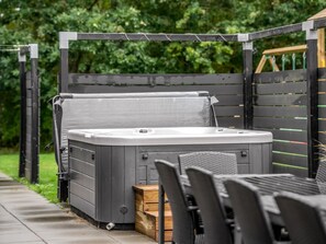 A hot tub with a metal frame and a wooden bench in front. - "Asel" - 350m from the sea by Interhome (Grenaa)