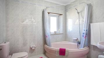 Bathtub, hair dryer, towels