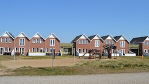 A row of red brick houses with white trim and gabled roofs. - "Maura" - 2.3km from the sea by Interhome (Rømø)