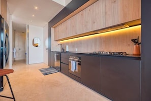 Coffee/tea maker, fridge, microwave, oven