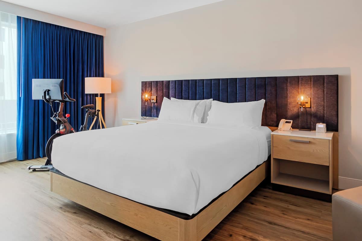 Premium Room, 1 King Bed, Pool View (with Peloton Bike) | 1 bedroom, premium bedding, pillowtop beds, in-room safe