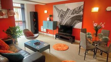 Standard Apartment | Living area | 40-inch LCD TV with cable channels