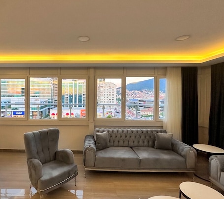 Deluxe Twin Room | Living area | Flat-screen TV. Lumiera Suites Hotel