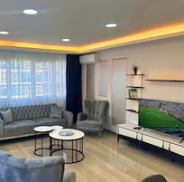 Deluxe Twin Room | Living area | Flat-screen TV