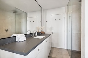 Shower, hair dryer, towels, shampoo