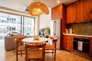 Kitchen amenities include a refrigerator, oven, stove and microwave - Romantic Zone Gem @ Nomada | Walk to Beach (Puerto Vallarta)