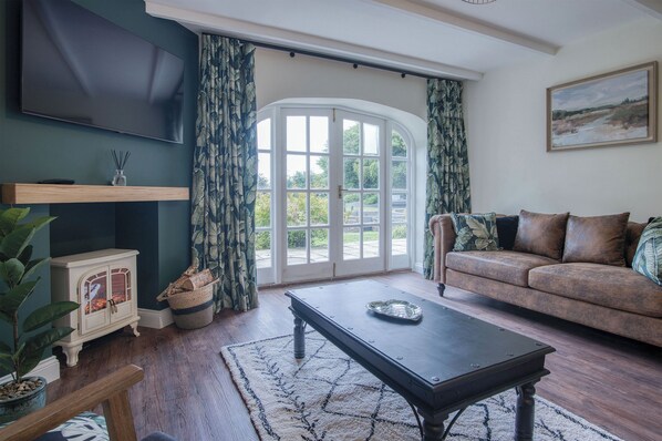 32-inch Smart TV with cable channels, fireplace