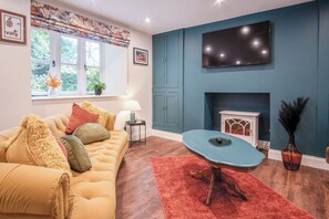 32-inch Smart TV with cable channels, fireplace