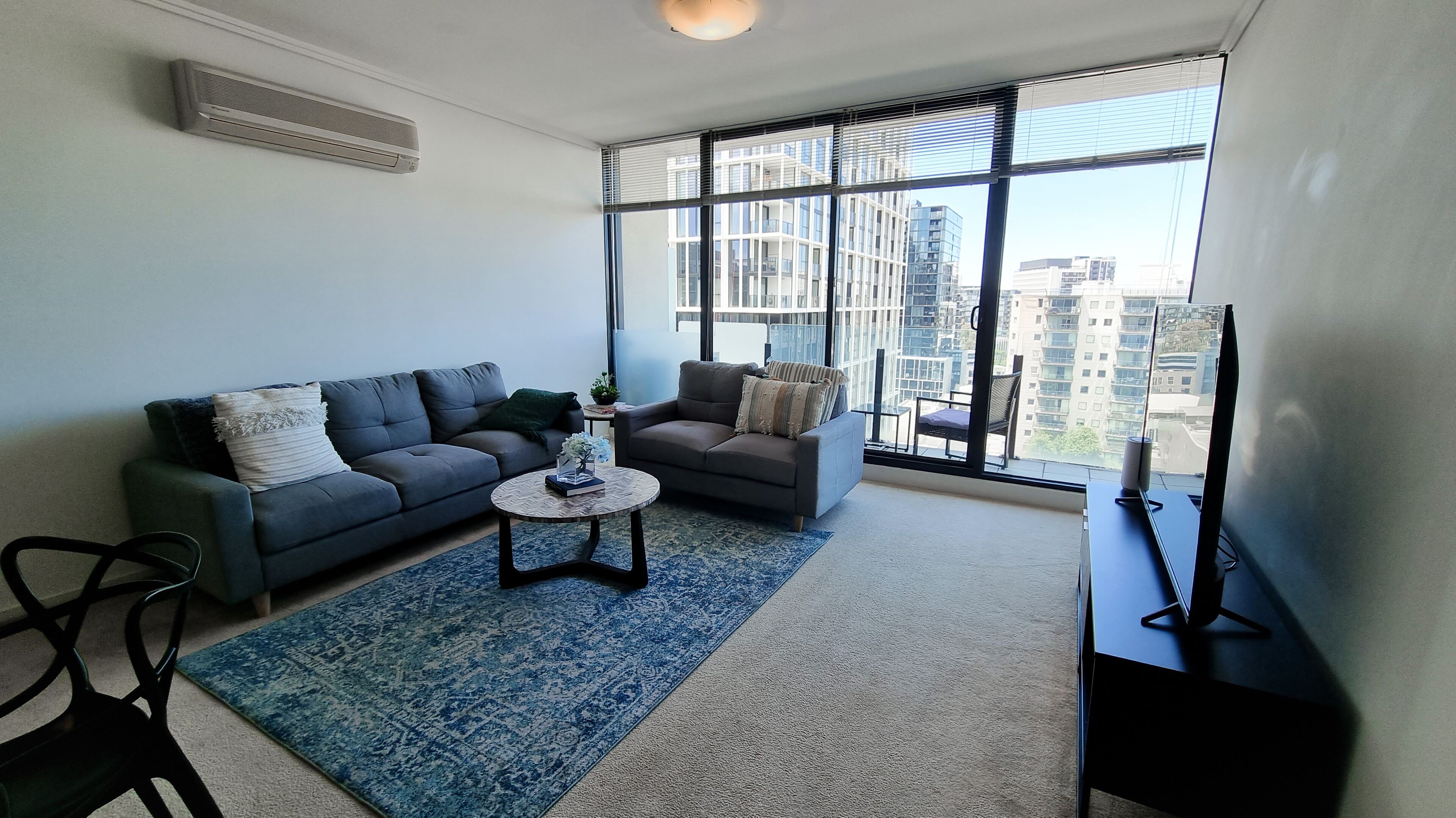 Deluxe Apartment | Living area | 55-inch LED TV with cable channels