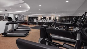A modern gym with multiple treadmills, weight machines, and a clean, well-lit environment. - Dream Las Vegas Retreat Steps from the Strip! (Las Vegas)
